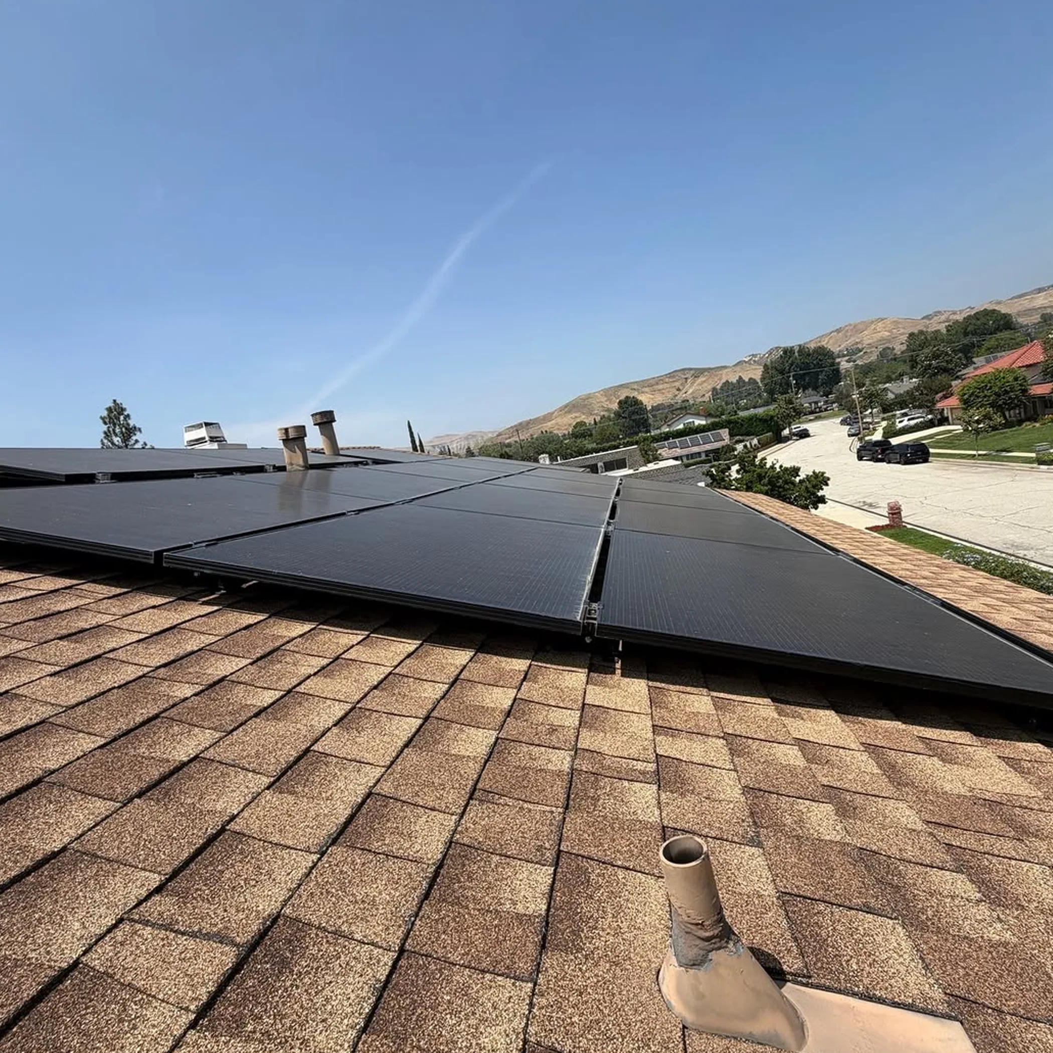 rooftop solar panels being maintained