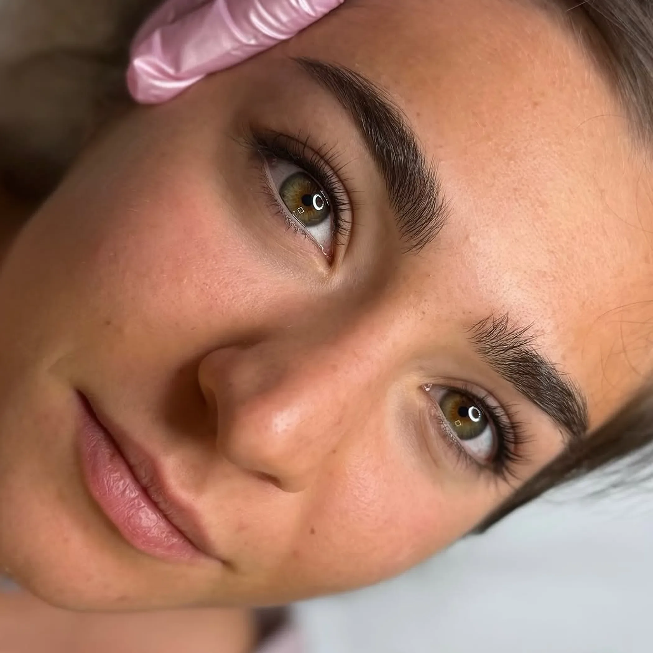 eyeliner tattoo procedure in progress